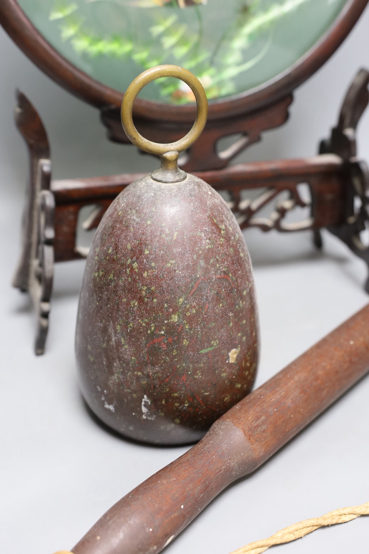 A Serpentine door-stop, Chinese table screen and a Victorian truncheon, Chinese table screen 46.5 cms high.